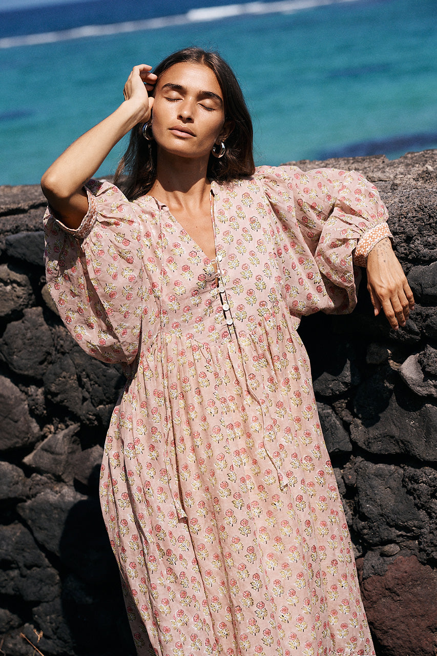 Bhoomi Maxi Dress Sunset — billowed sleeve detail against stone wall, hand block print cotton | Daughters of India