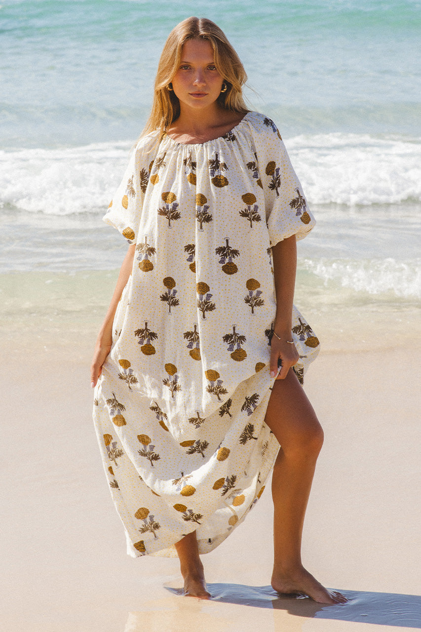 Dahlia Maxi Dress Marigold — relaxed inclusive fit at beach, off-shoulder, flowing white linen maxi with golden hand block print, ethical artisan dress | Daughters of India