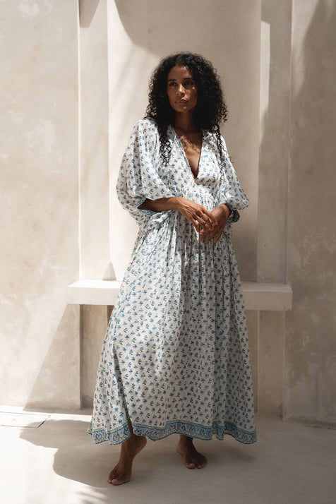 Daughters of India Kyra Maxi Dress in Azure — full length front view against cream wall, blue floral block print cotton