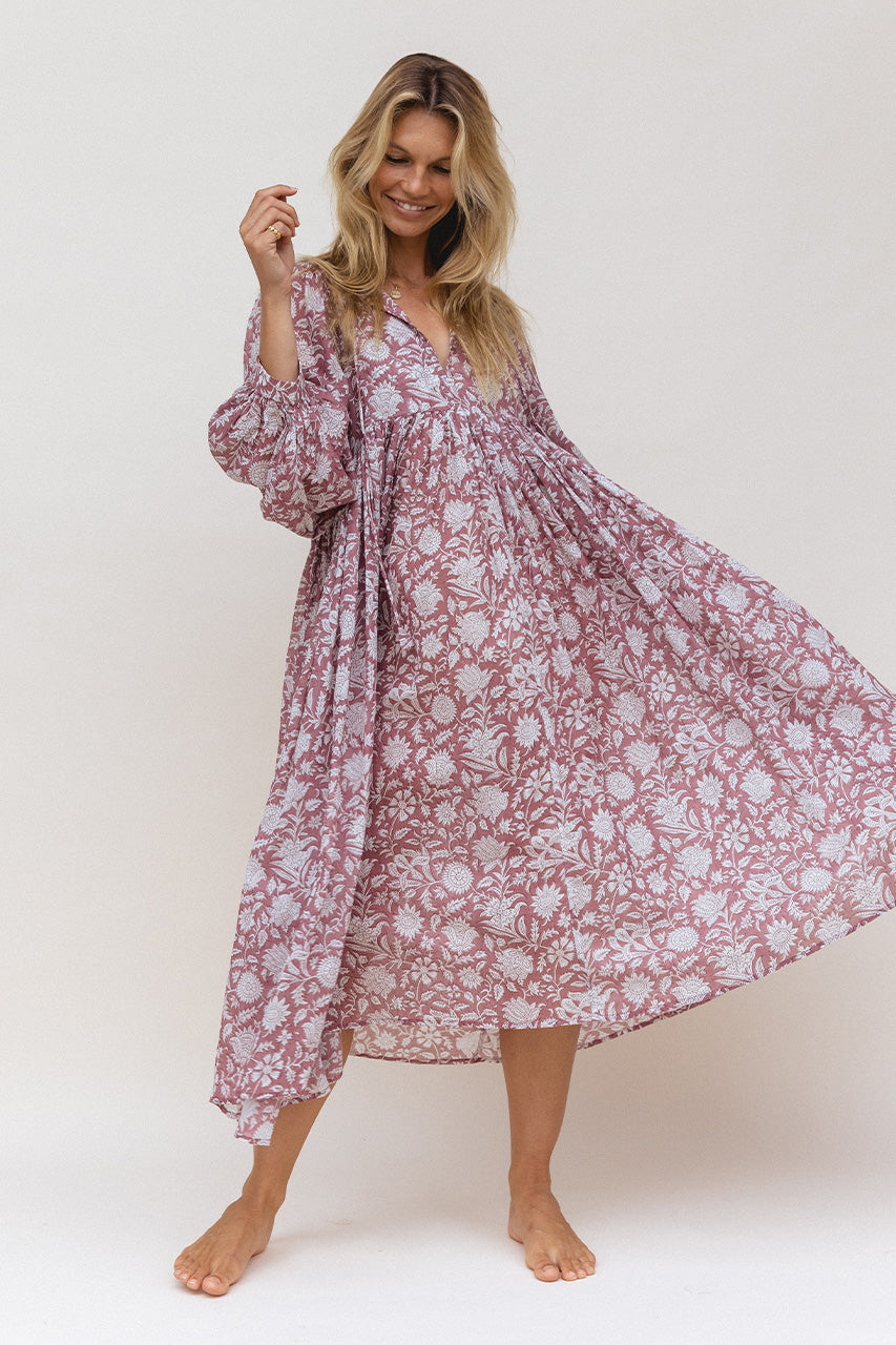 Daughters of India Kyra Midi Dress in Musk — studio twirling with flowing skirt, V-neckline, hand screen print cotton