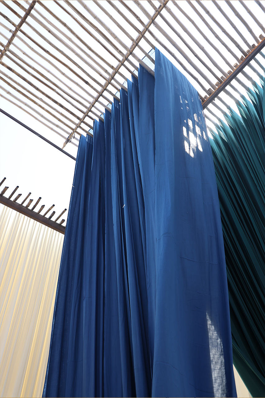 Natural indigo dyed fabric drying in Jaipur — ethical slow fashion process, Daughters of India
